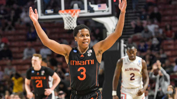 University of Miami guard Charlie Moore (3) celebrates after teammate forward Sam Waardenburg (21) dunked against Auburn University during the second half of the NCAA Div. 1 Men's Basketball Tournament preliminary round game at Bon Secours Wellness Arena in Greenville, S.C. Sunday, March 20, 2022. Ncaa Mens Basketball Second Round Miami Vs Auburn Syndication The Greenville News